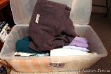 Large tote with hinged lid filled with a nice wool blanket, crocheted throw, sheets for garden