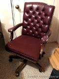 Rolling office chair rolls and swivels as it should. Upholstery is in decent shape, arms are a bit