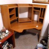 Corner style work station or desk has a lot of storage and seems in good shape. Approx. 5' across