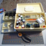 Sewing box with notion, plus Singer Flexi-Stitch guides or attachments, Fiskars cutting mat and