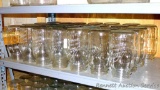 Twenty eight Kerr narrow mouth quart canning jars.