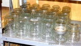 Twenty four Kerr wide mouth pint canning jars; four Kerr wide mouth half pint canning jars.
