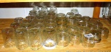 Two dozen half pint canning jars; 3 Kerr wide mouth canning jars; 19 other jelly jars.