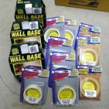 Three packages self-stick wall base edging; iron-on melamine and veneer edging new in package