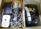 Power strip, cordless phone, answering machines, assorted cables, cords antenna and more.