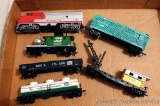 Model railroad HO scale engine and cars including a Bachmann Santa Fe engine, Quaker State tanker
