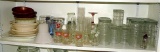 Assorted drinking glasses, juice glasses, A&W mugs, 7-UP glass, Coca-Cola glass, shakers, a mix of