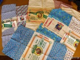 Eight vintage feed sacks all from Flambeau Milling Company, Phillips, Wis and Flam-bo Feeds.