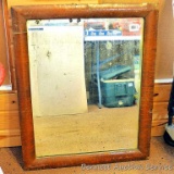 Antique wood framed mirror has some silvering missing, measures approx. 27