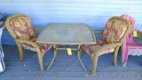 Glass topped patio table comes with matching patio chairs with cushions. Table is about 42