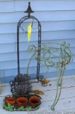 Plant stands, wind chime stand, spinning yard ornament, more. Wind chime stand is about 34
