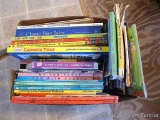 Box of children's books includes I Spy, Classic Fairy Tales, some homeschooling books, Baby's First
