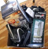 Box full of electronic extras like cords, connectors, telephones, batteries, chargers and lots more.