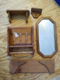 Several wall hanging wooden shelf units; wooden framed wall mirror is 11