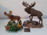 Two moose figurines, one with a candle holder. Larger one is 7-1/2