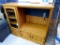 Wooden cabinet unit has glass front side storage with 3 adjustable shelves, double door storage and