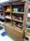 Vintage wooden hutch with 3 drawers on the bottom and 2 doors with glass inserts on top and 2