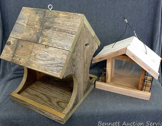 Two wooden bird feeders with one have suet feeders on the side; largest measures 12" x 13-1/2" x 16"