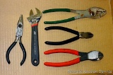 Ace adjustable wrench; wire cutters; pliers. Longest piece 8