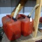 Pair of 5.8 gallon gas totes with spouts.