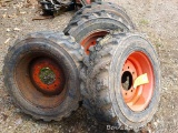 Skid loader rims off of a 763G Bobcat. Solid tires for junkyard work and similar. Rims are marked