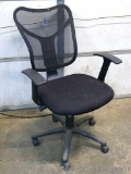 Rolling padded chair. Couldn't get it to raise or lower, but it rolls smoothly. Chair measures 24