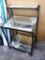 Nice entry table with glass shelves is about 21
