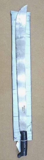 Machete marked "Tramontina Brazil" is nearly 3' long.