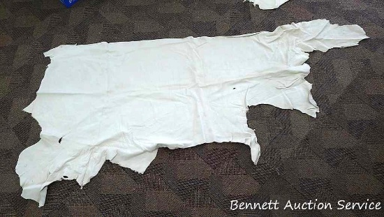 Nice leather tanned cow hide is about 66" x 30".