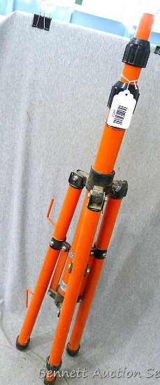 Handy work tripod extends up to around 6' tall. Top of pole is 1" wide.