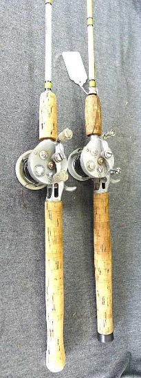 Two True Temper "Speed Lock" fishing poles have Pflueger Supreme reels. Longer rod is about 66"