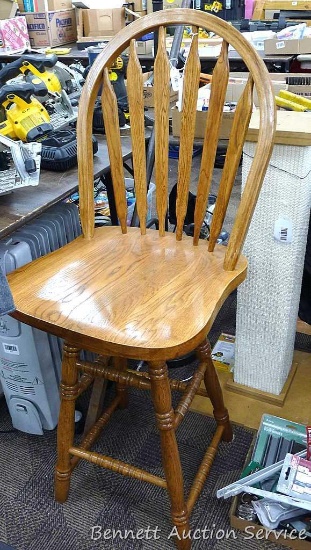 Solid wooden swivel chair, seat is aprox. 25" tall.
