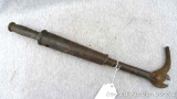 Antique nail puller is marked with a 