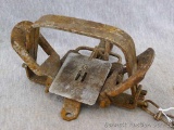 Hudson Bay No. 3 coil spring animal trap, pan is also marked 'Model Perfect Herter's Inc.'.