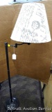Tall, French themed living room lamp with adjustable horizontal arm.
