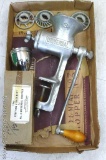 Universal No. 3 food chopper with heads and a shiny stuffing attachment with box. Grinder is about