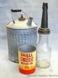 Shell X-100 Motor Oil can, galvanized oil can with wooden handle, and n oil bottle with The Master