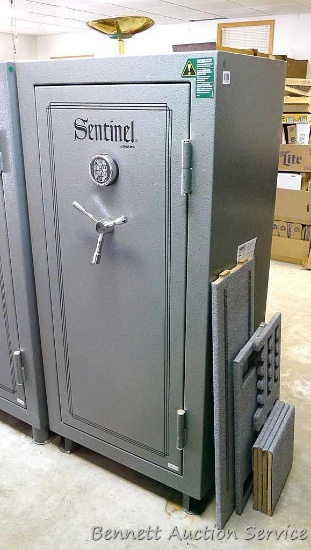 Sentinel electronic combination gun safe by Stack On comes with a key, door mounted handgun sleeve