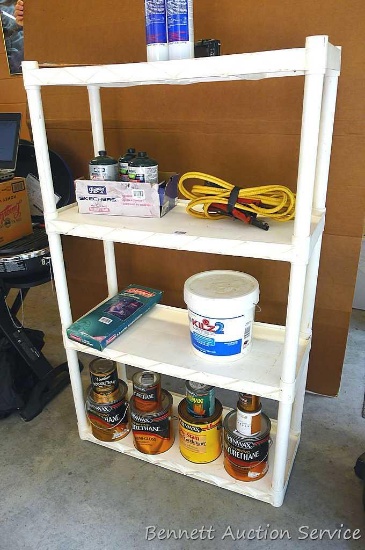 Plastic 4 shelf unit; measures 34" x 14" x 56" tall.