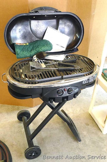 Coleman RoadTrip Grill, uses propane and folds up for easy travel and storage, comes with a few