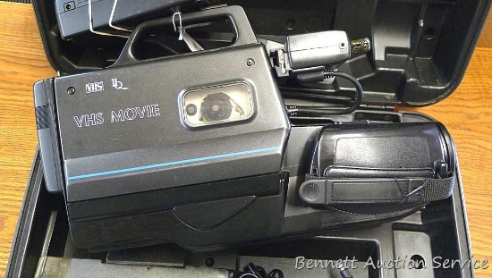 Vintage solid state CCD VHS movie camera has 6x zoom, auto focus, extra lens, flash, cords and hard