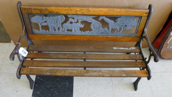 Little children's bench with cast iron ends and back. Back shows African animals incl lion,