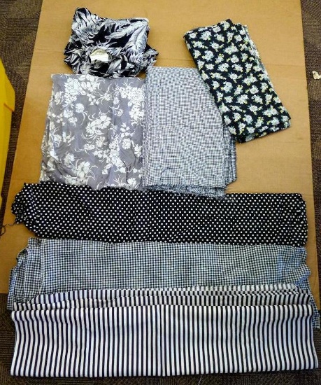 Fun vintage black and white material. At least three pieces are 3' wide. Material in top left corner