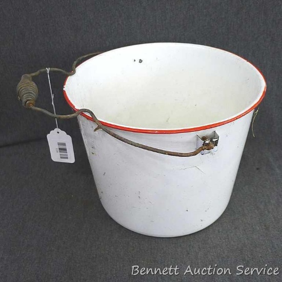 Red and white enameled would look great full of flowers or balsam branches for Christmas. Has a