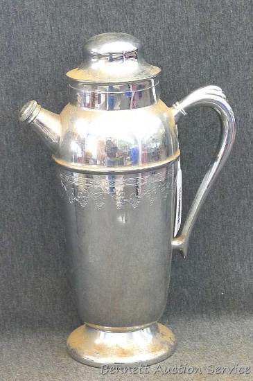 Unique wine decanter is about 12" tall.