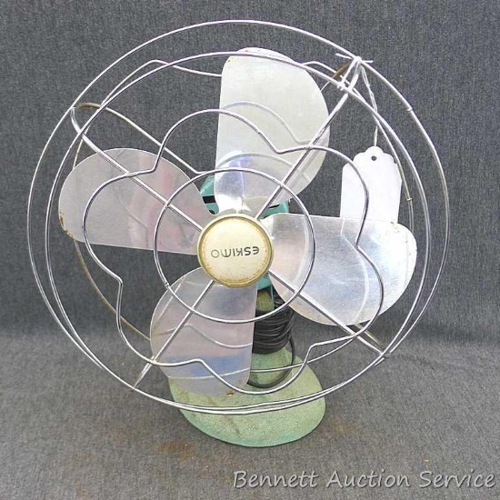 Cheery blue Eskimo fan, runs and is about 12" tall