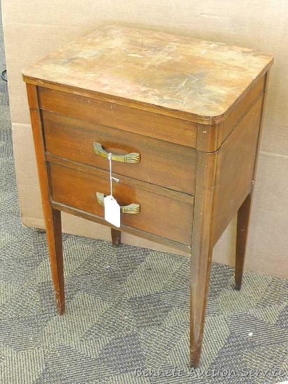 Sewing cabinet with two dove-tailed drawers and removable top with ample thread storage. Cabinet