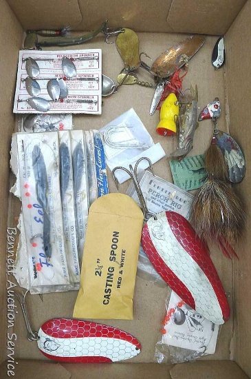 Assortment of fishing spoons, spinners, flex eels and more. Largest spoon measures approx.. 8" long.