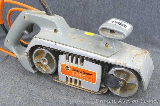 Black and Decker U-144 Belt Sander measures approx.. 16" x 4" x 6", runs.