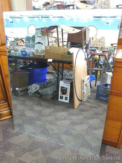 Large wall mirror has vertical or horizontal mounting brackets; measures 36" x 46". Mirror is in